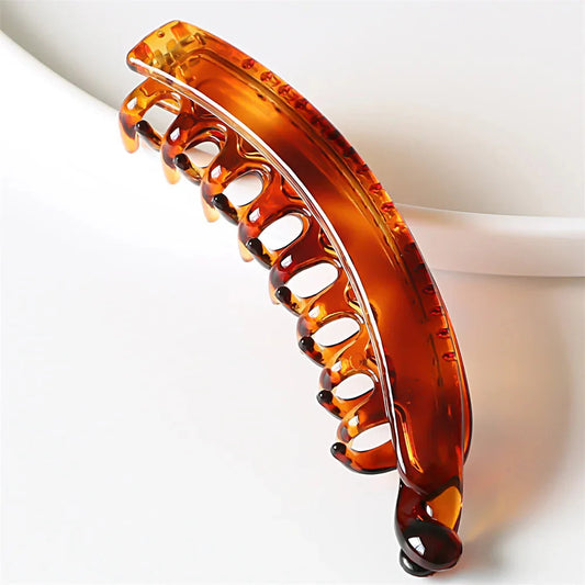 Frosted banana hair clip in terracotta orange variant 2
