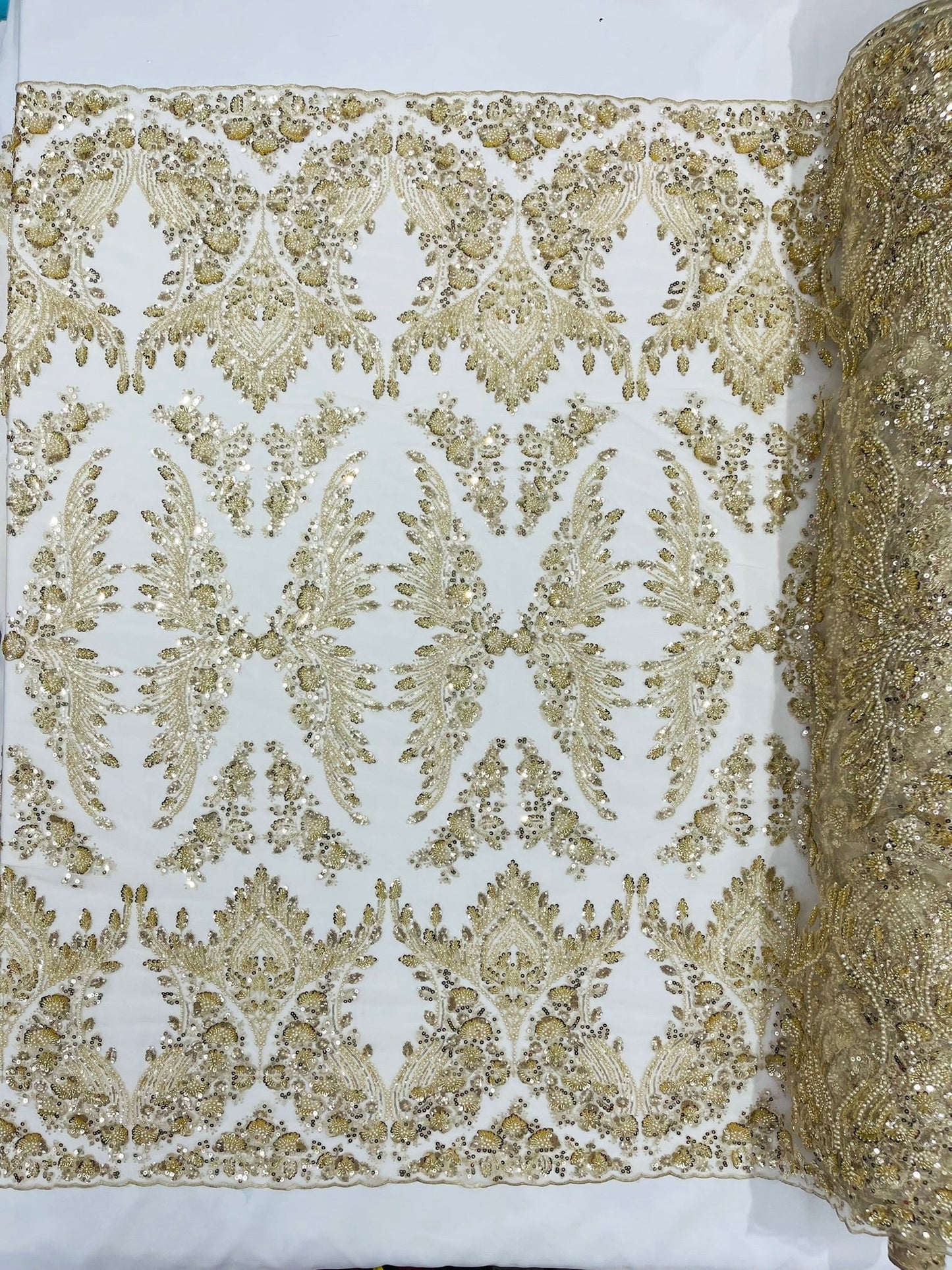 Damask Wing Design Embroidered Heavy Beaded Lace on 54" Mesh Fabric.