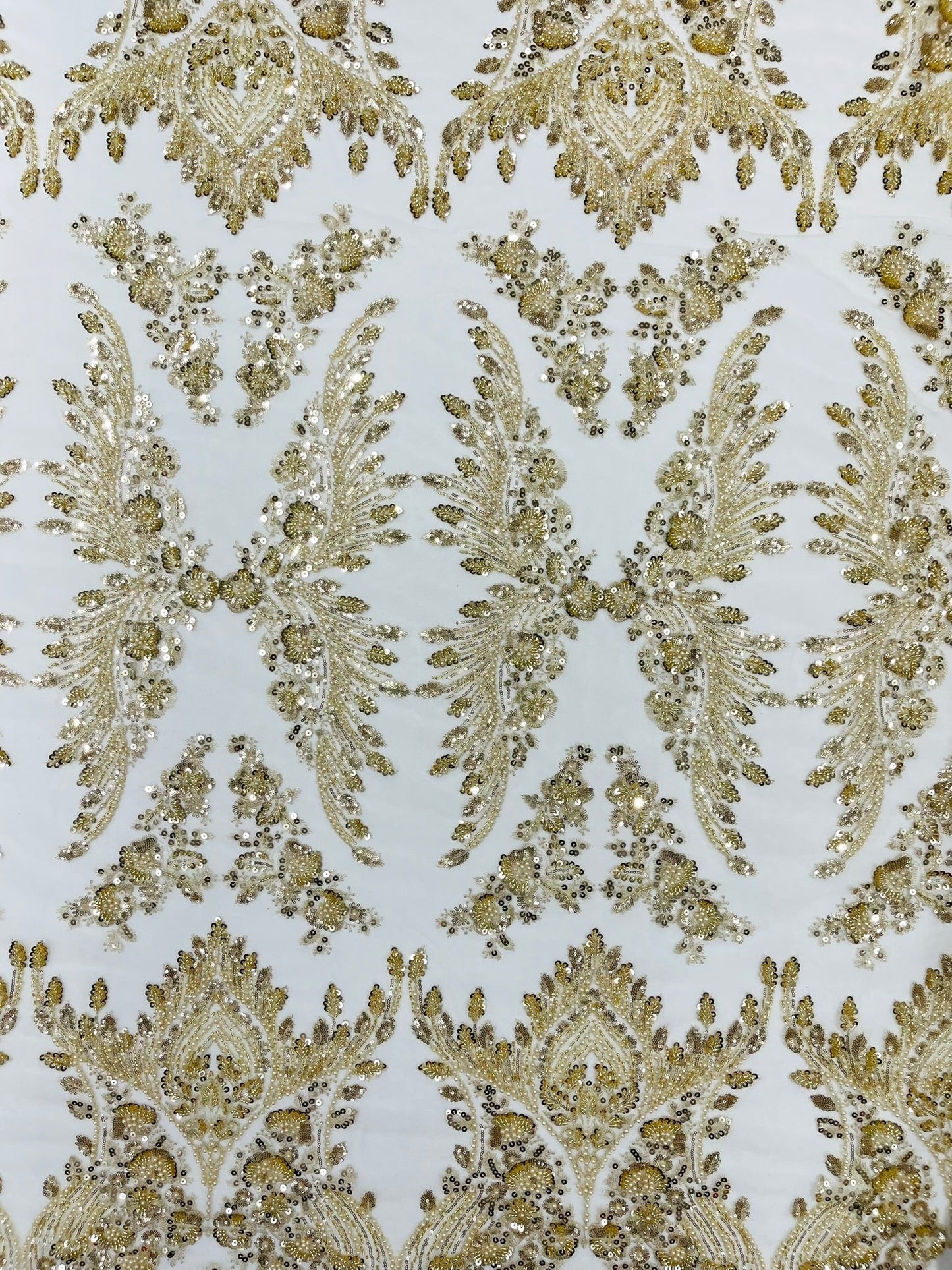 Damask Wing Design Embroidered Heavy Beaded Lace on 54" Mesh Fabric.