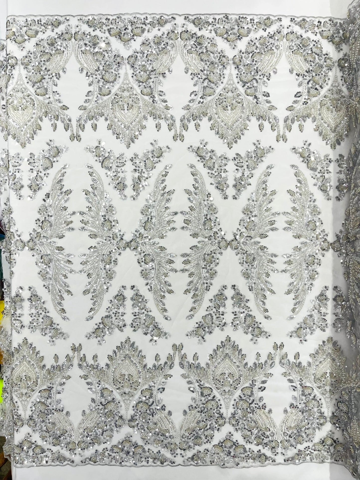 Damask Wing Design Embroidered Heavy Beaded Lace on 54" Mesh Fabric.
