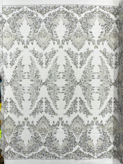 Damask Wing Design Embroidered Heavy Beaded Lace on 54" Mesh Fabric.