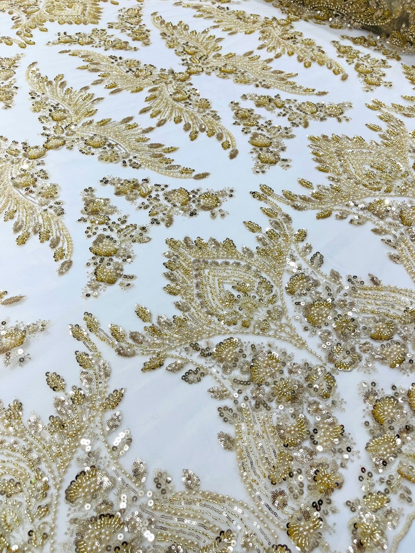 Damask Wing Design Embroidered Heavy Beaded Lace on 54" Mesh Fabric.