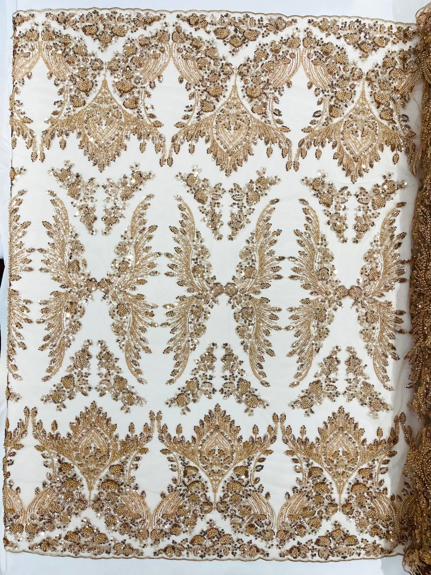 Damask Wing Design Embroidered Heavy Beaded Lace on 54" Mesh Fabric.