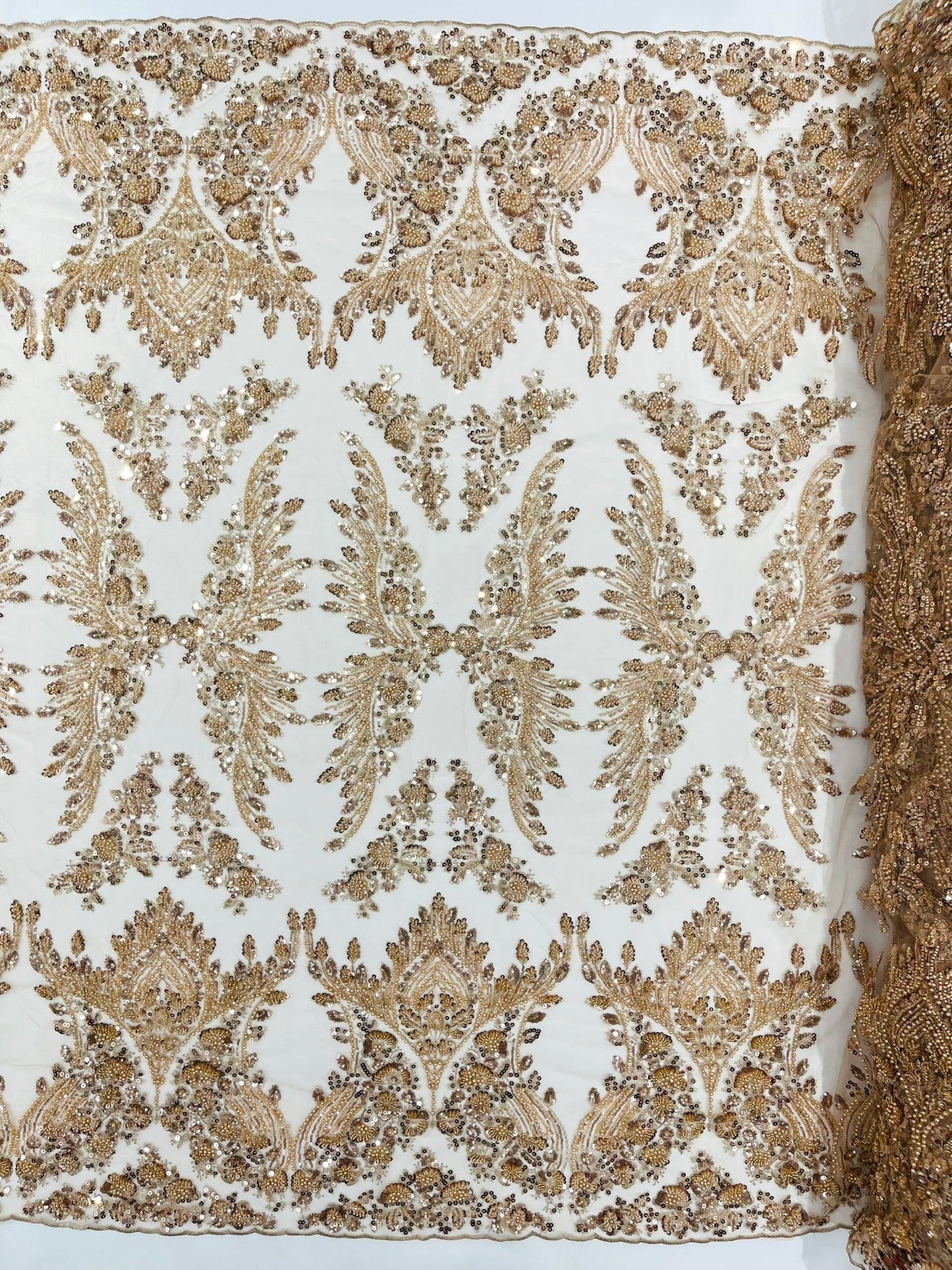 Damask Wing Design Embroidered Heavy Beaded Lace on 54" Mesh Fabric.