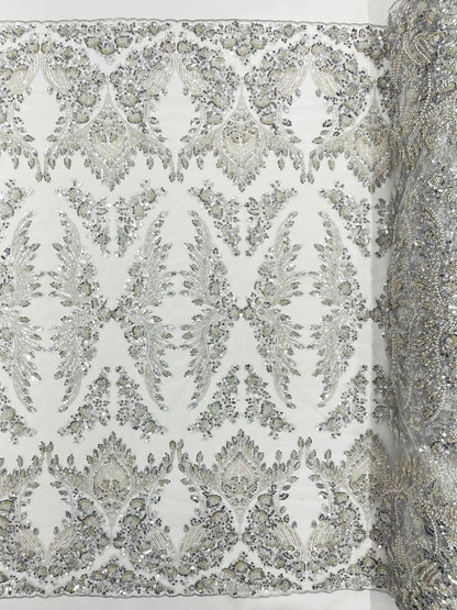 Damask Wing Design Embroidered Heavy Beaded Lace on 54" Mesh Fabric.