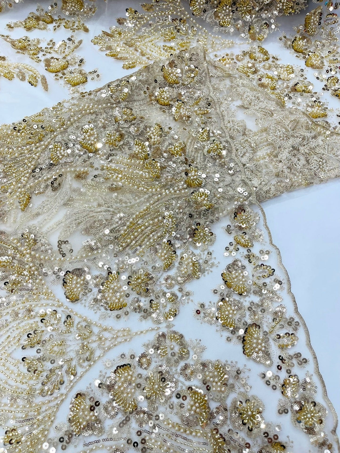 Damask Wing Design Embroidered Heavy Beaded Lace on 54" Mesh Fabric.
