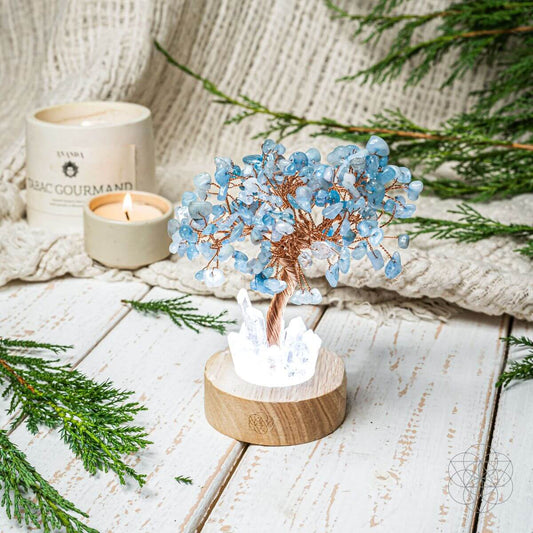 Guardian Angel aquamarine crystal lamp glowing on wooden base